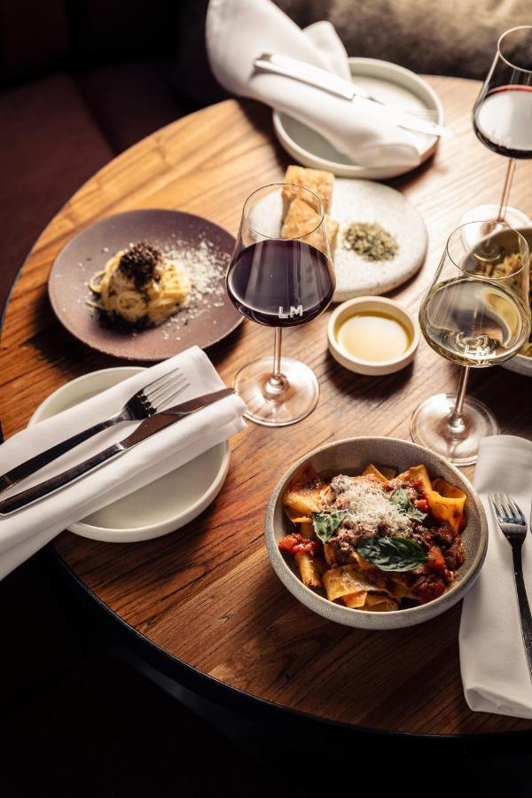 Next Hotel Melbourne, Curio Collection By Hilton Экстерьер фото A selection of dishes at the restaurant